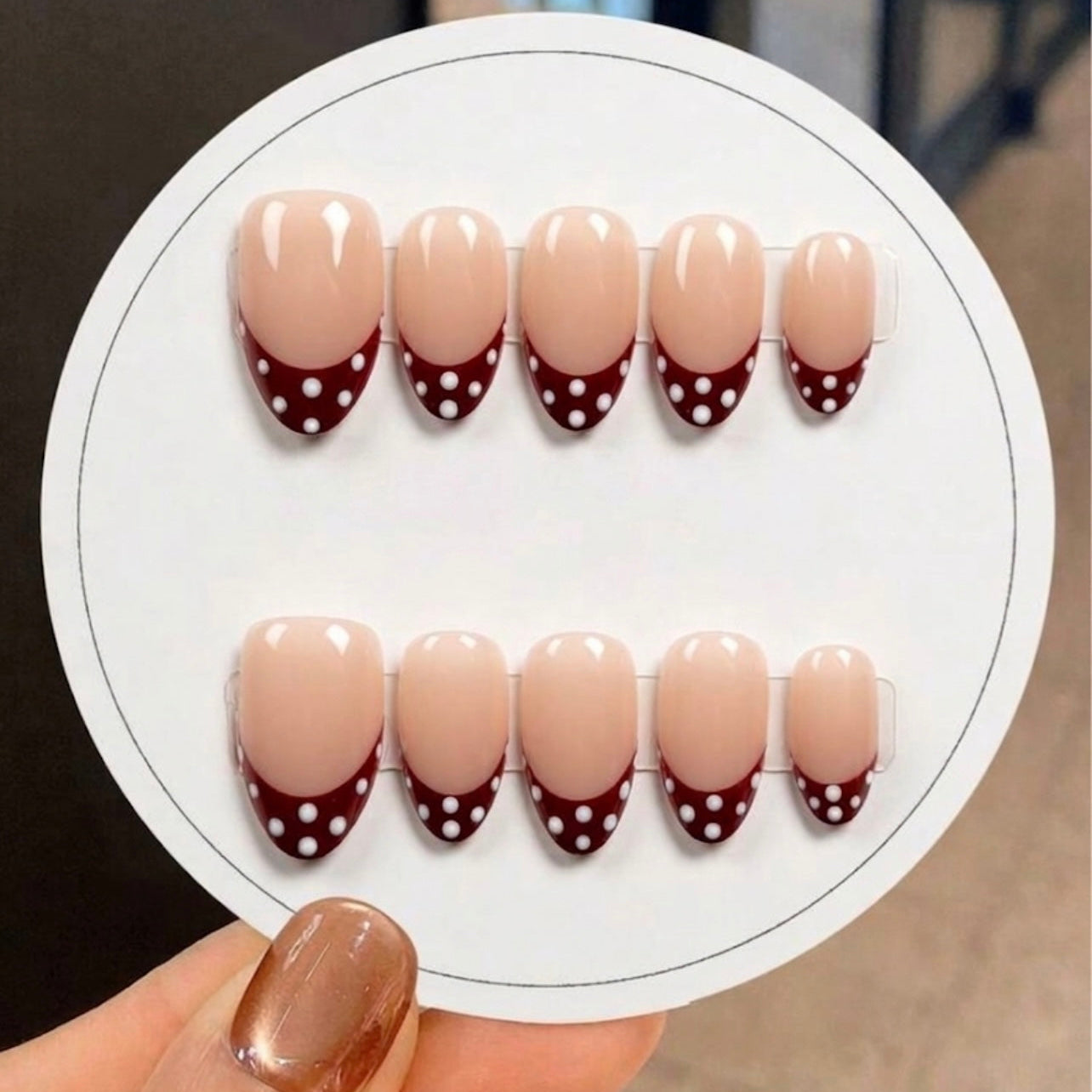 Burgundy polka dot nails